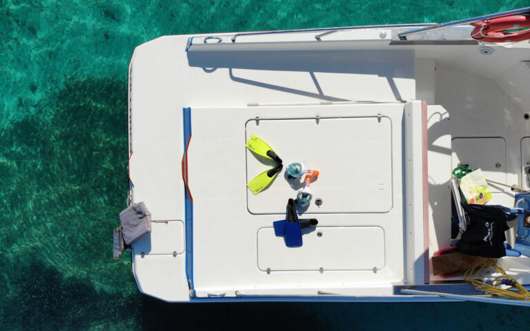 Snorkeling equipment on board a private boat in Mallorca above crystal-clear waters