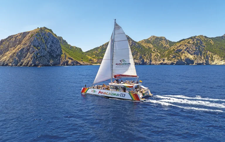 Catamaran tour sailing along the coast of Alcúdia, Mallorca